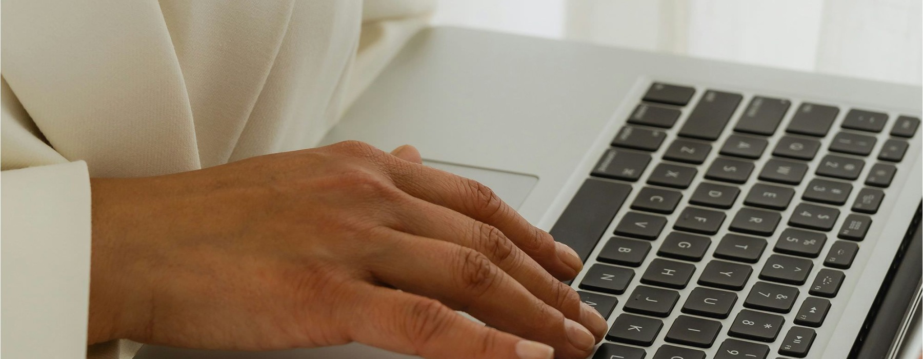 a person typing on a laptop