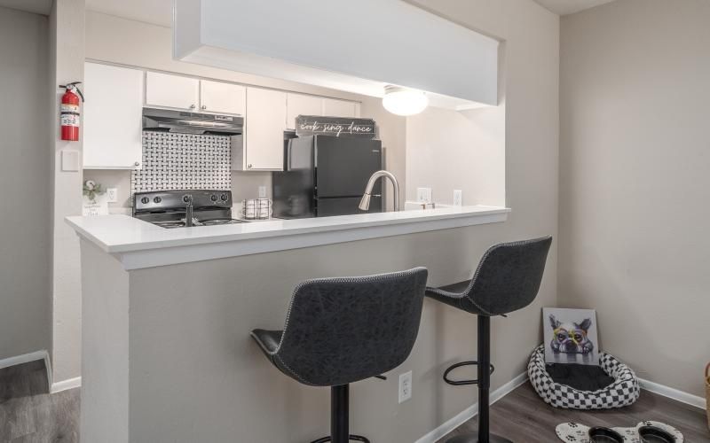 a kitchen bar with seating