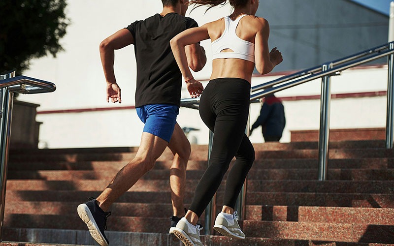 people jogging up stairs